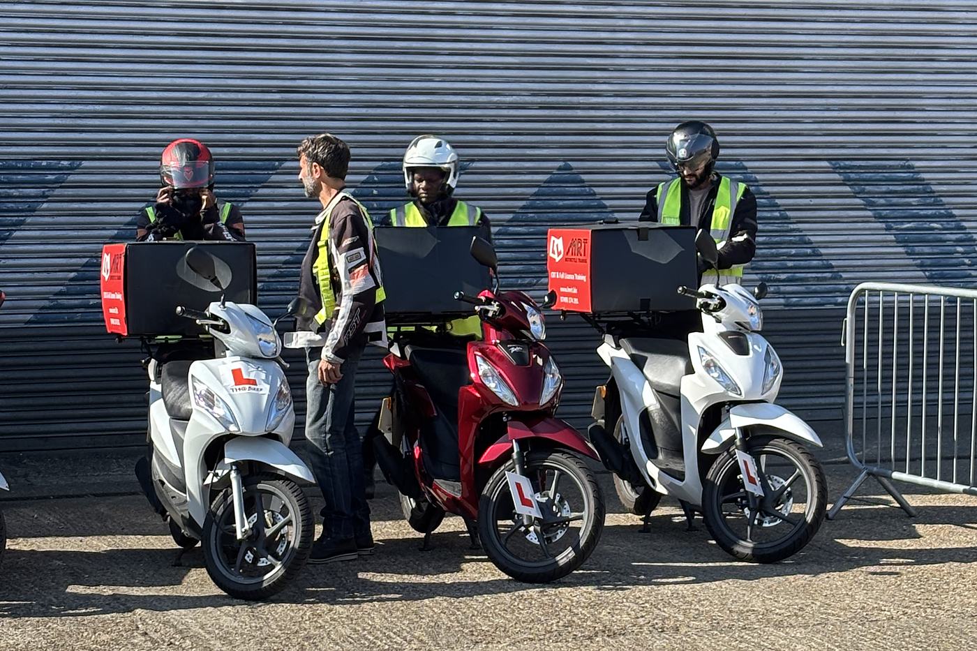 LMRT riders kitted up beside their scooters at the Grove Park training centre